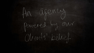 Writing on a blackboard: an agency powered by our clients' belief